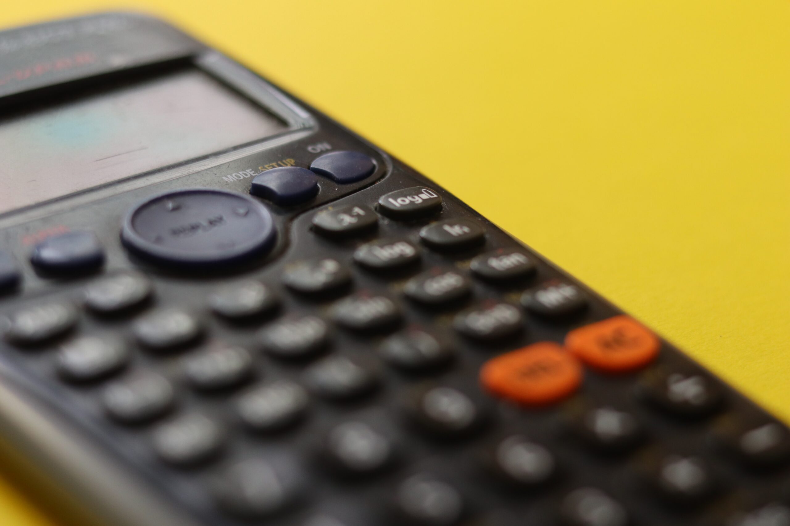 Calculator placed on a yellow background
