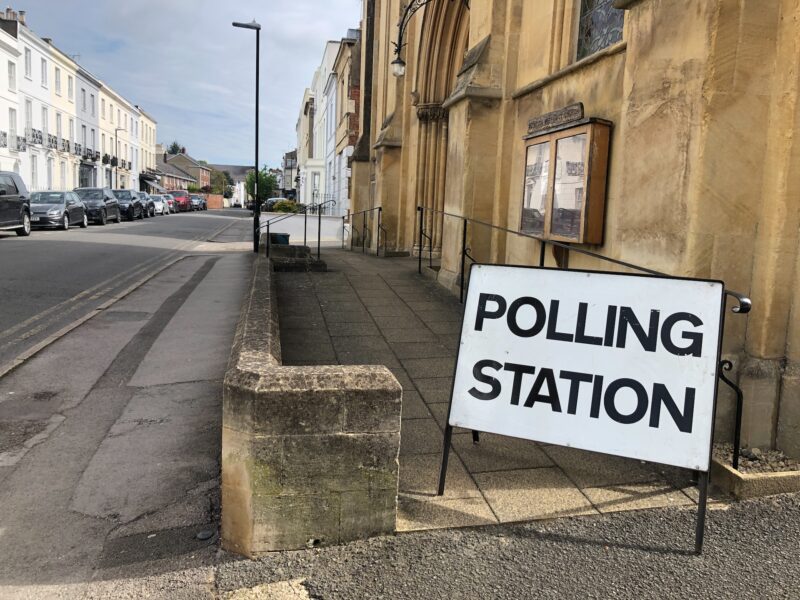 A polling station sign outside a building - you must join the electoral roll to vote in UK elections